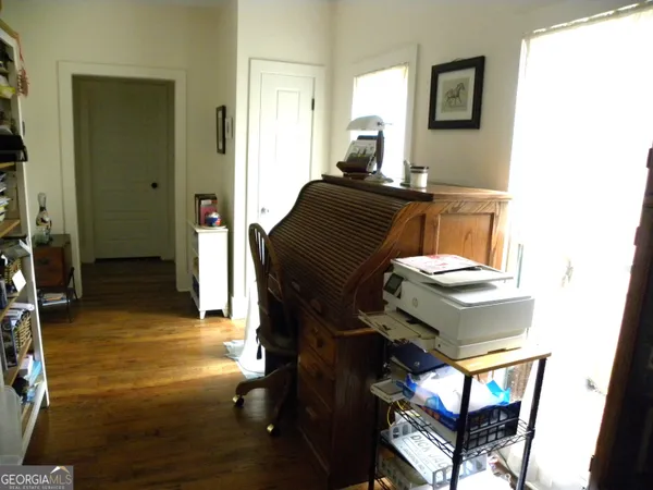 a kitchen with stainless steel appliances a dining table chairs and granite counter tops