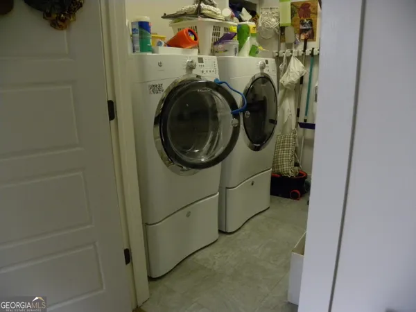 a kitchen with stainless steel appliances granite countertop a stove and a refrigerator