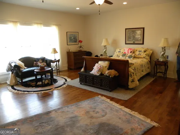 a view of a room with a table and chairs