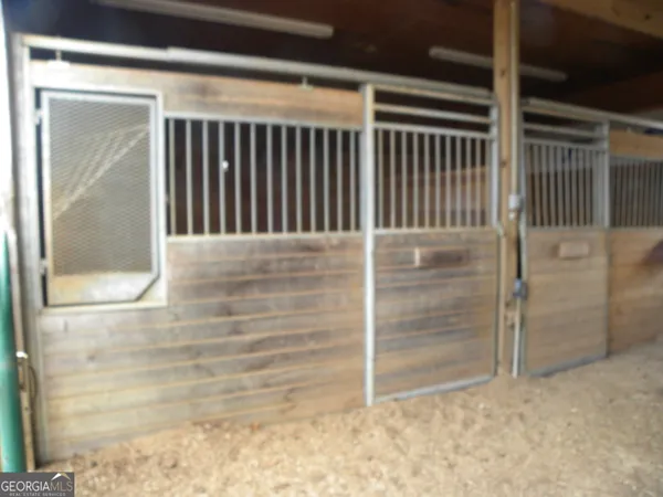 a living room with furniture and painting on the wall