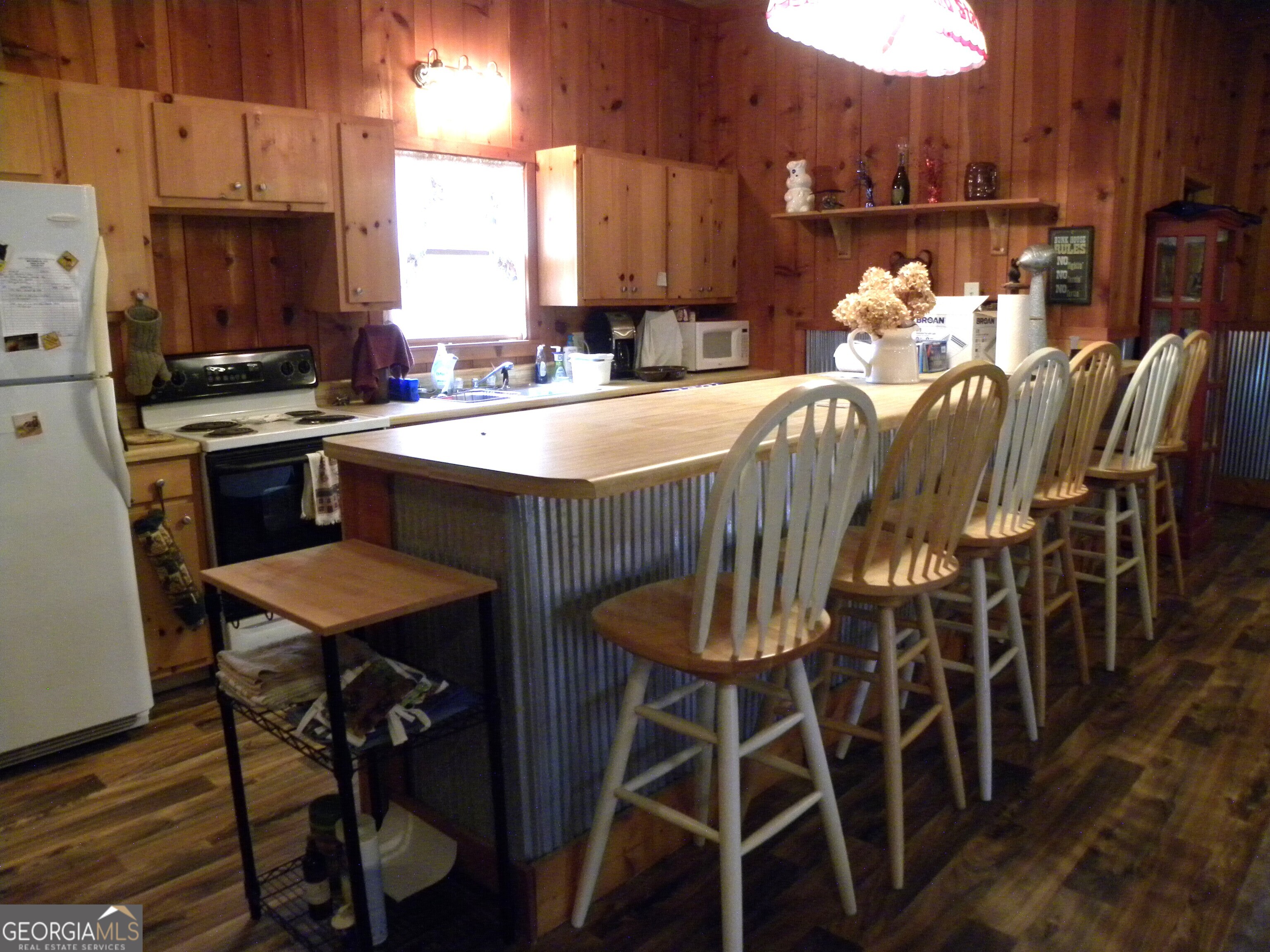 551 P Road Toccoa, GA 30577 - Photo 92 of 124 a kitchen with stainless steel appliances a dining table chairs and granite counter tops