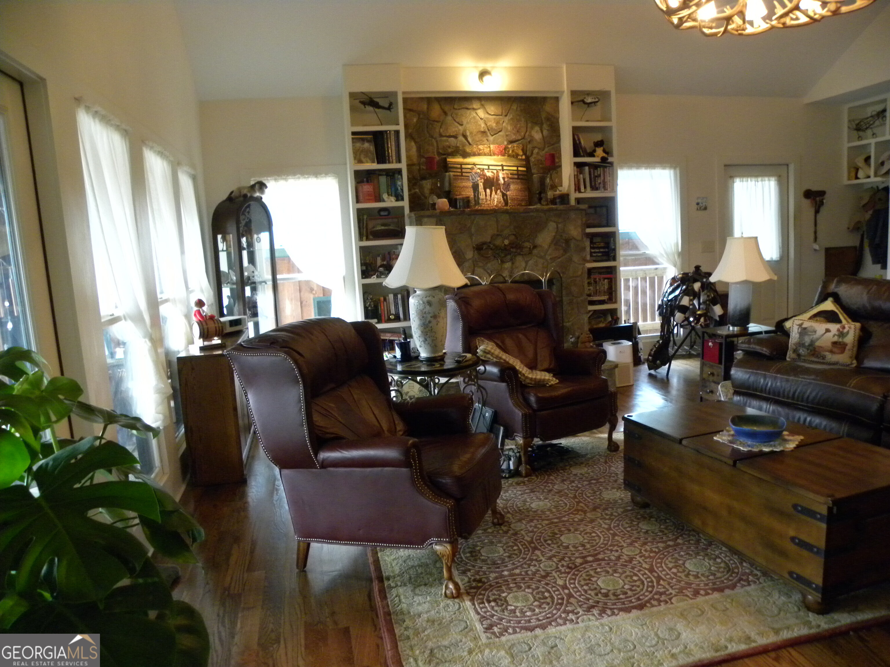 551 P Road Toccoa, GA 30577 - Photo 10 of 124 a living room with furniture and a potted plant