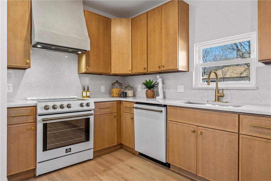 2211 Morrow Avenue Waco, TX 76707 - Photo 12 of 39 a kitchen with cabinets appliances and a sink