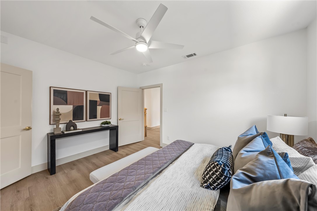 2211 Morrow Avenue Waco, TX 76707 - Photo 17 of 39 a bedroom with a bed and flat screen tv