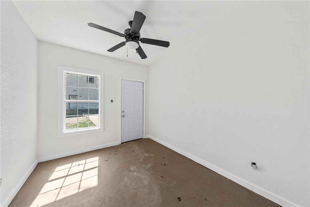 2211 Morrow Avenue Waco, TX 76707 - Photo 31 of 39 a view of a big room with wooden floor and windows