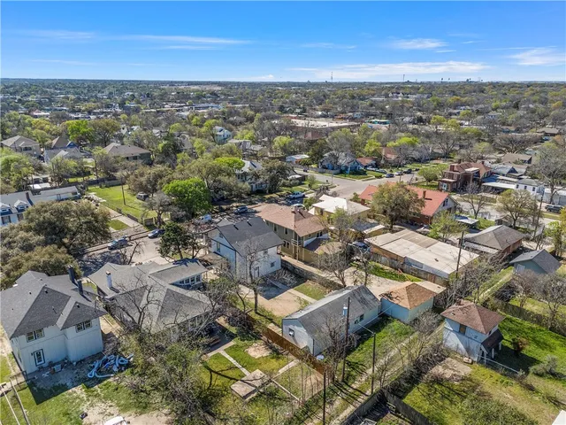 an aerial view of residential building with parking space