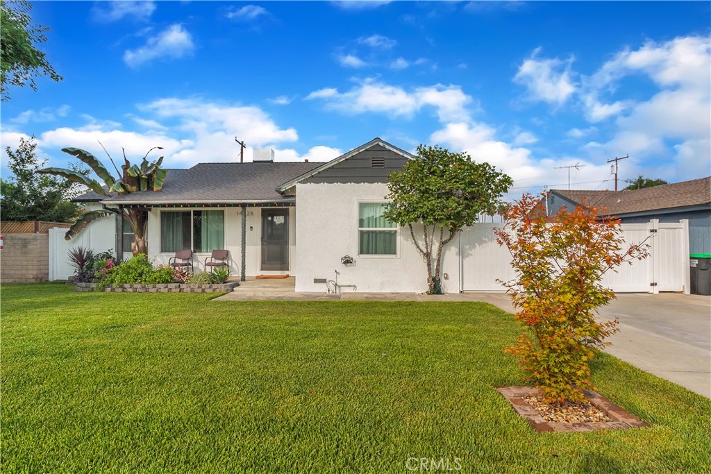 14228 Oval Drive Whittier, CA 90604 - Photo 1 of 1 a front view of a house with a garden