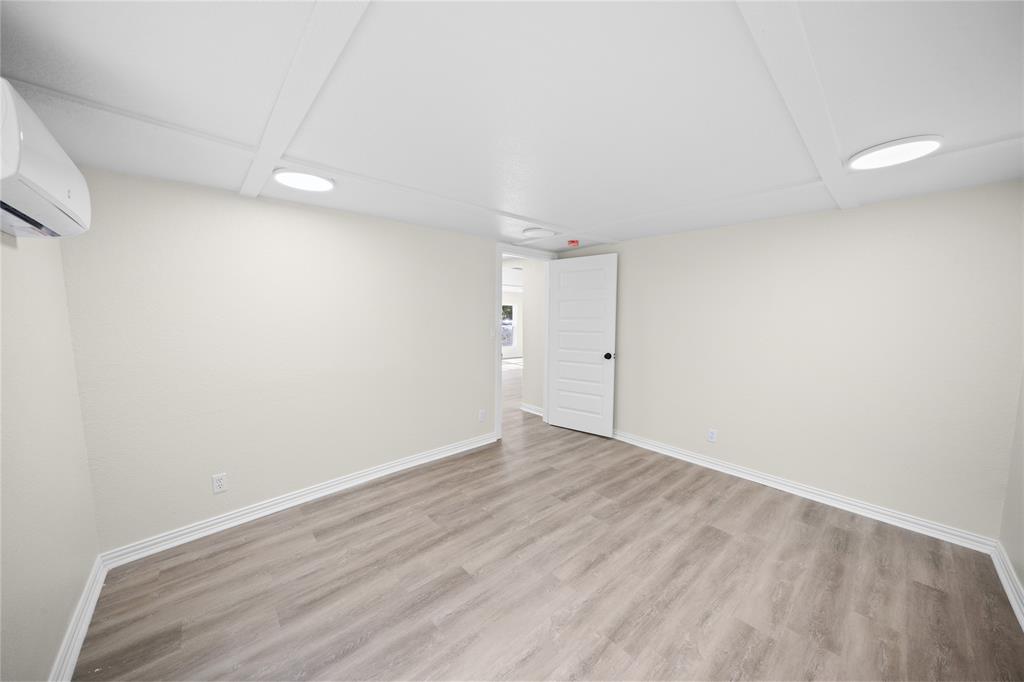 823 Clark Street Tyler, TX 75701 - Photo 11 of 17 a view of an empty room with wooden floor