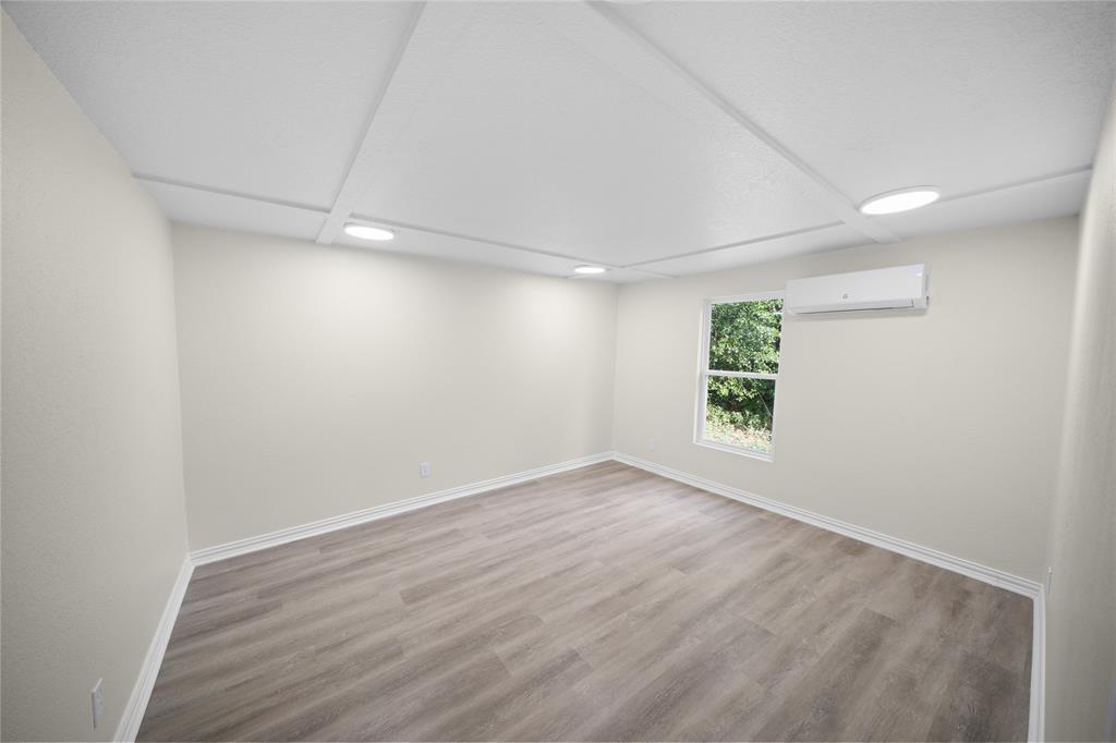 823 Clark Street Tyler, TX 75701 - Photo 12 of 17 wooden floor in an empty room