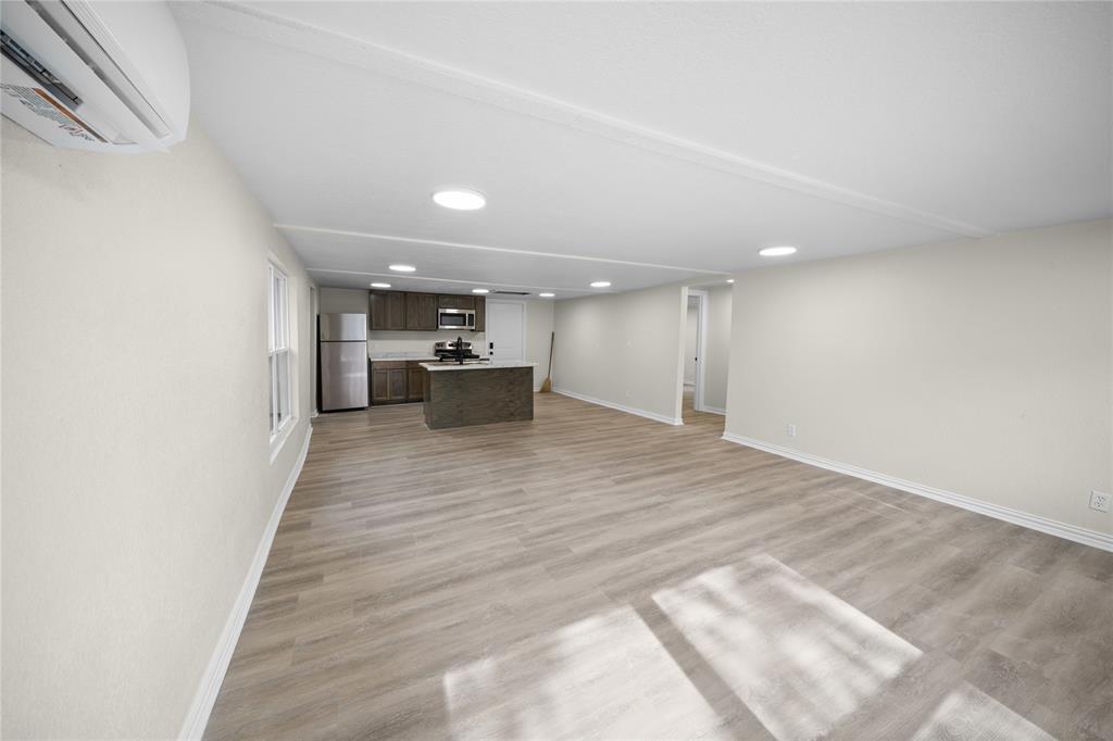 823 Clark Street Tyler, TX 75701 - Photo 2 of 17 a view of a room with wooden floor and furniture