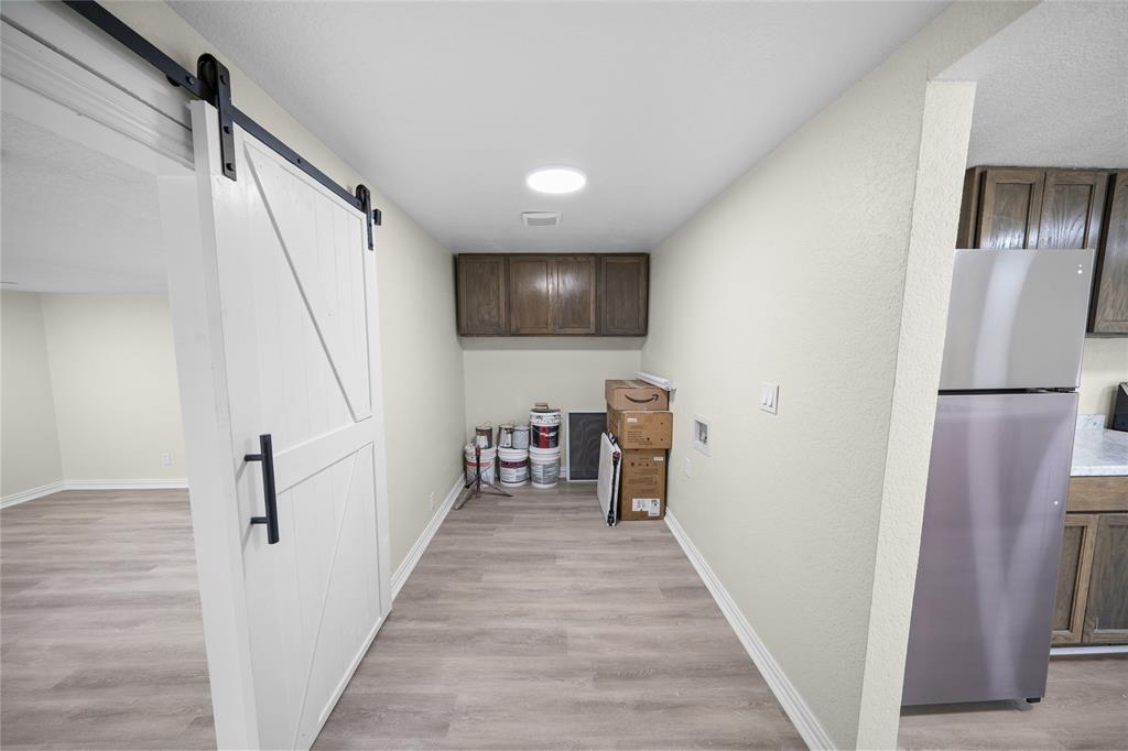 823 Clark Street Tyler, TX 75701 - Photo 6 of 17 a view of a hallway with the wooden floor and staircase