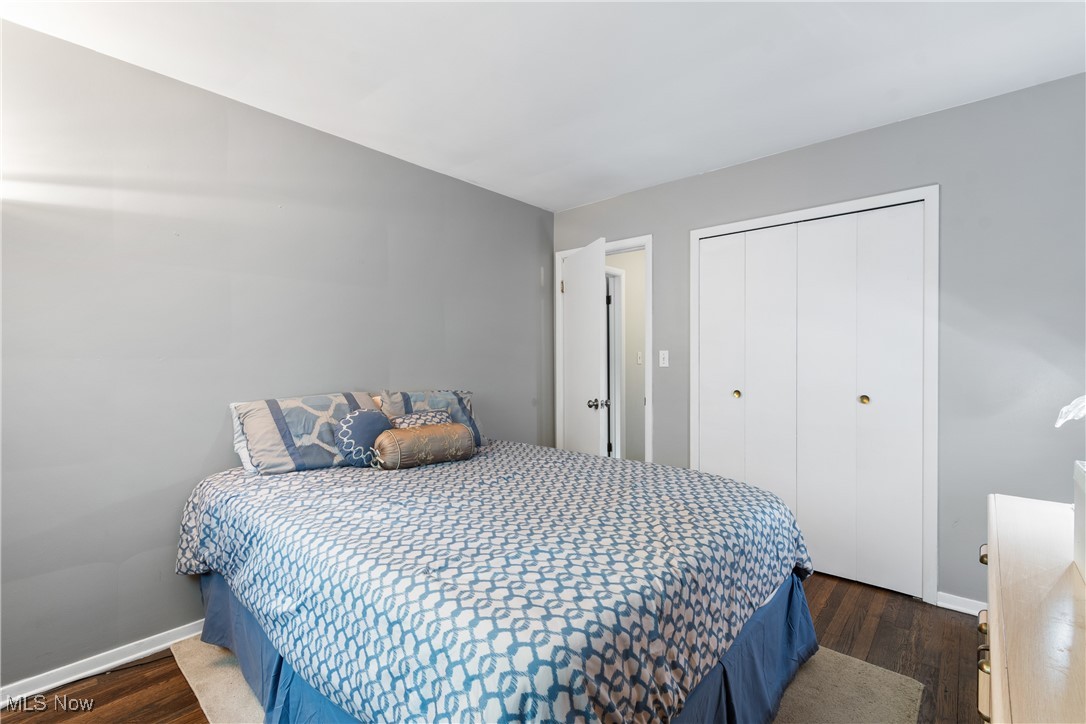6751 Glenview Road Cleveland, OH 44143 - Photo 18 of 31 Bedroom featuring baseboards, wood finished floors, and a closet