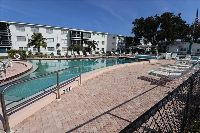 a view of swimming pool with outdoor seating