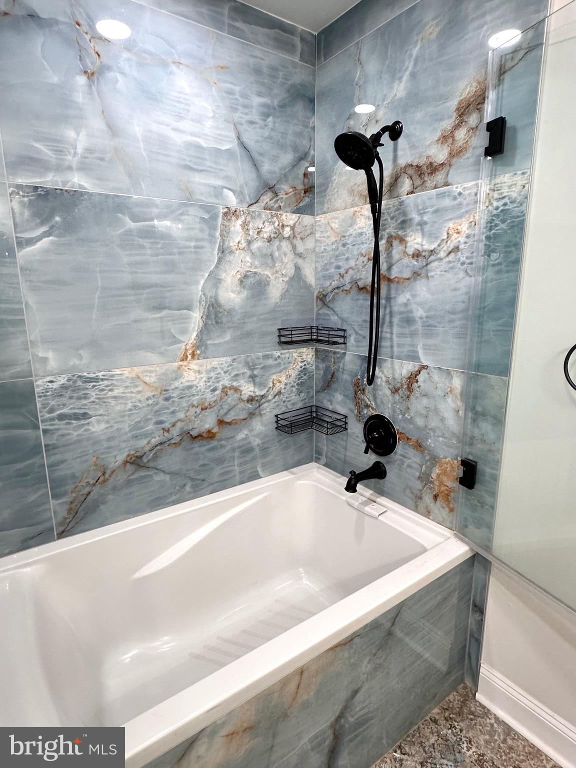 1201 North Garfield Street, Unit 408 Arlington, VA 22201 - Photo 10 of 26 a bathroom with a bathtub