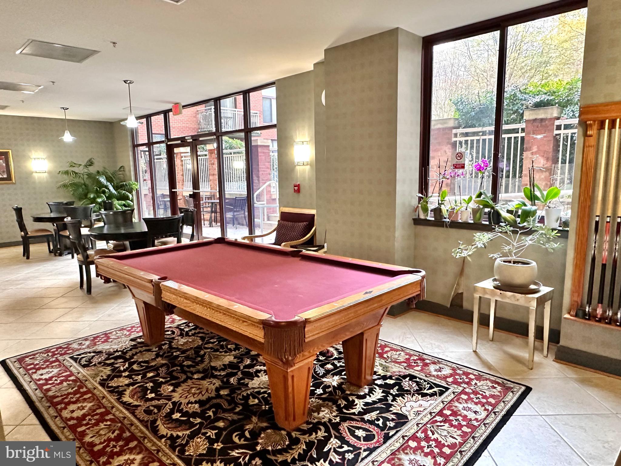 1201 North Garfield Street, Unit 408 Arlington, VA 22201 - Photo 19 of 26 a patio with table and chairs