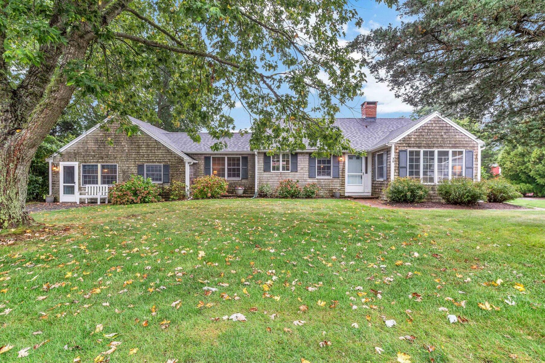 30 Cove Road Eastham, MA 02642 - Photo 13 of 72 a front view of a house with a yard