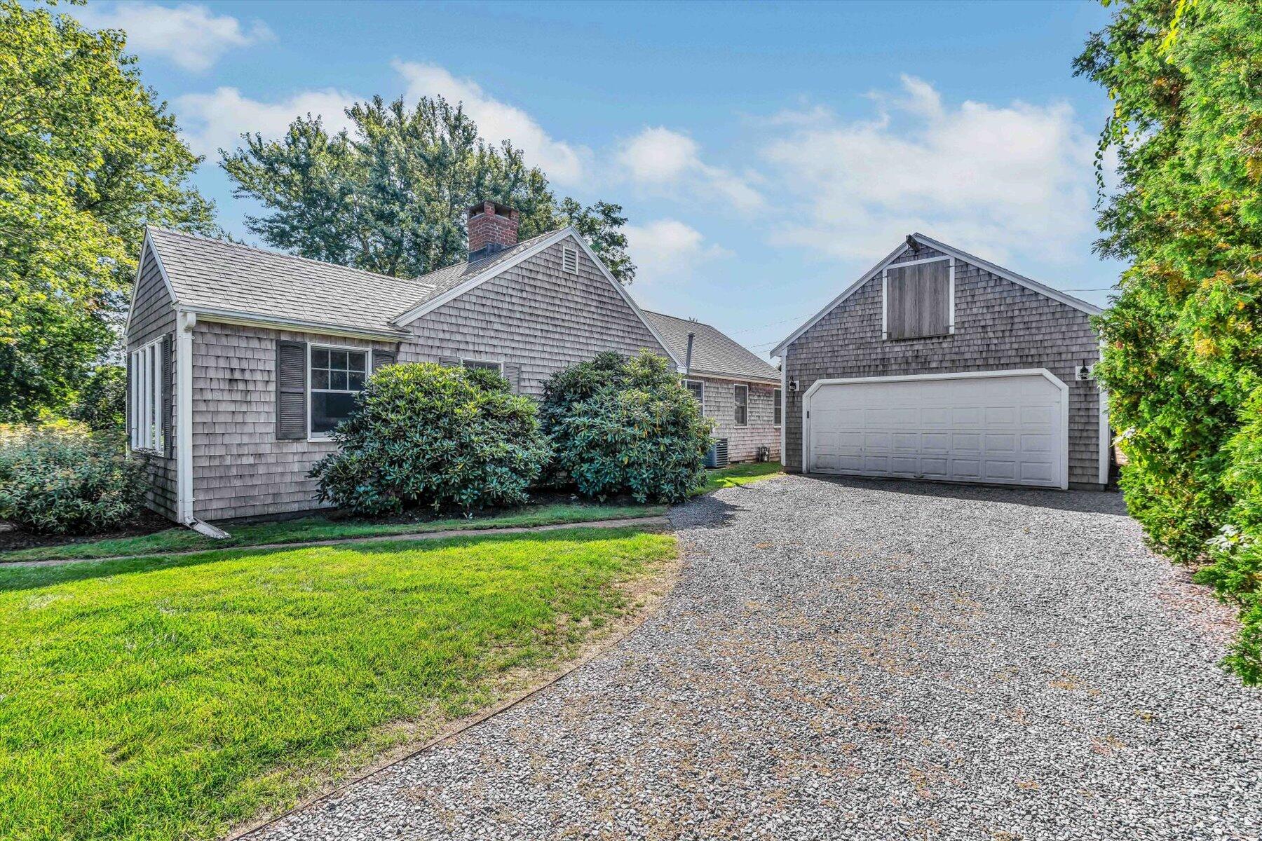30 Cove Road Eastham, MA 02642 - Photo 17 of 72 a front view of house with yard and green space