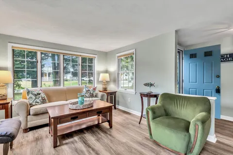 a view of hallway with wooden floor