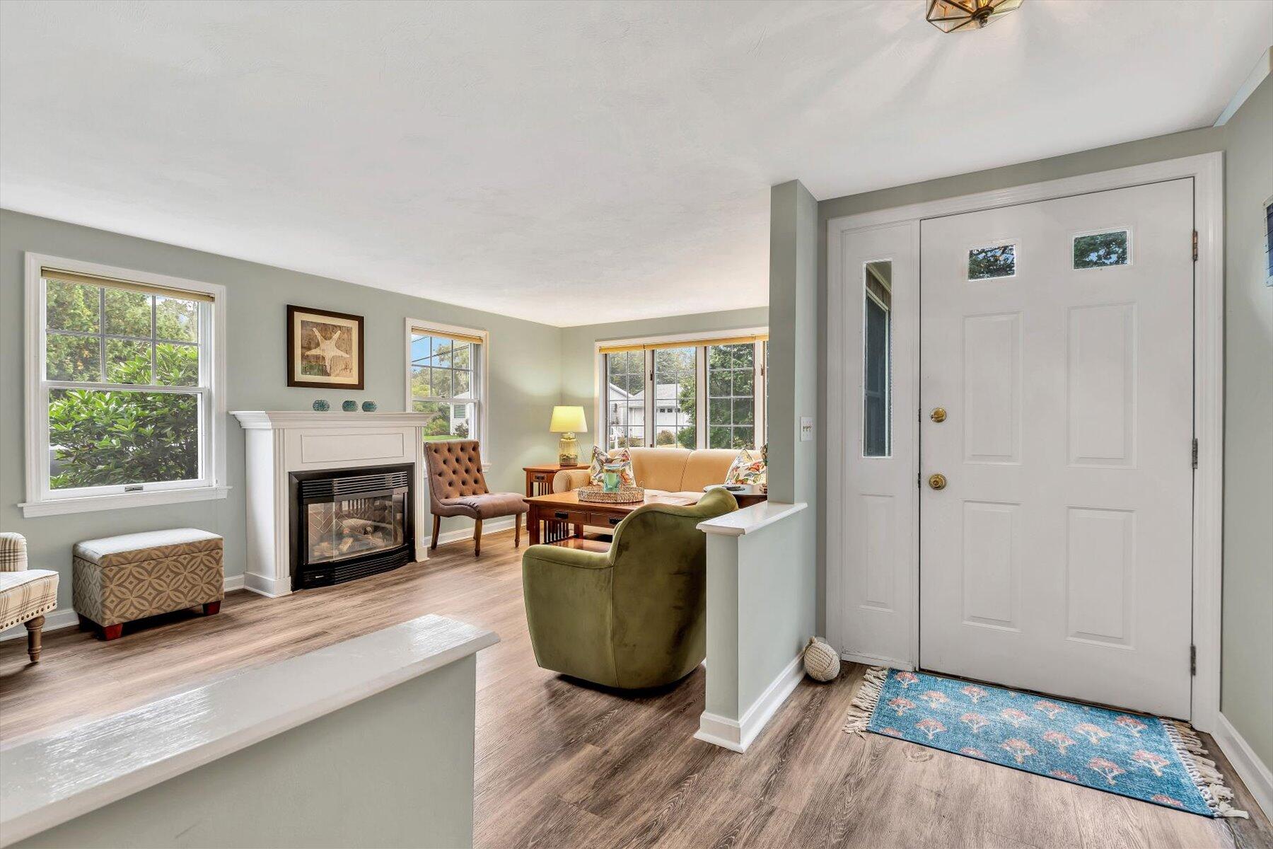 30 Cove Road Eastham, MA 02642 - Photo 19 of 72 a living room with furniture and a fireplace