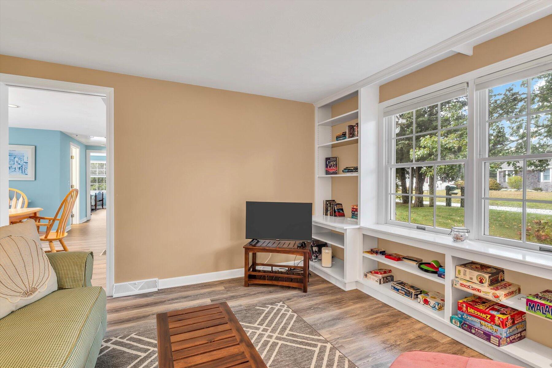 30 Cove Road Eastham, MA 02642 - Photo 26 of 72 a living room with furniture and a window