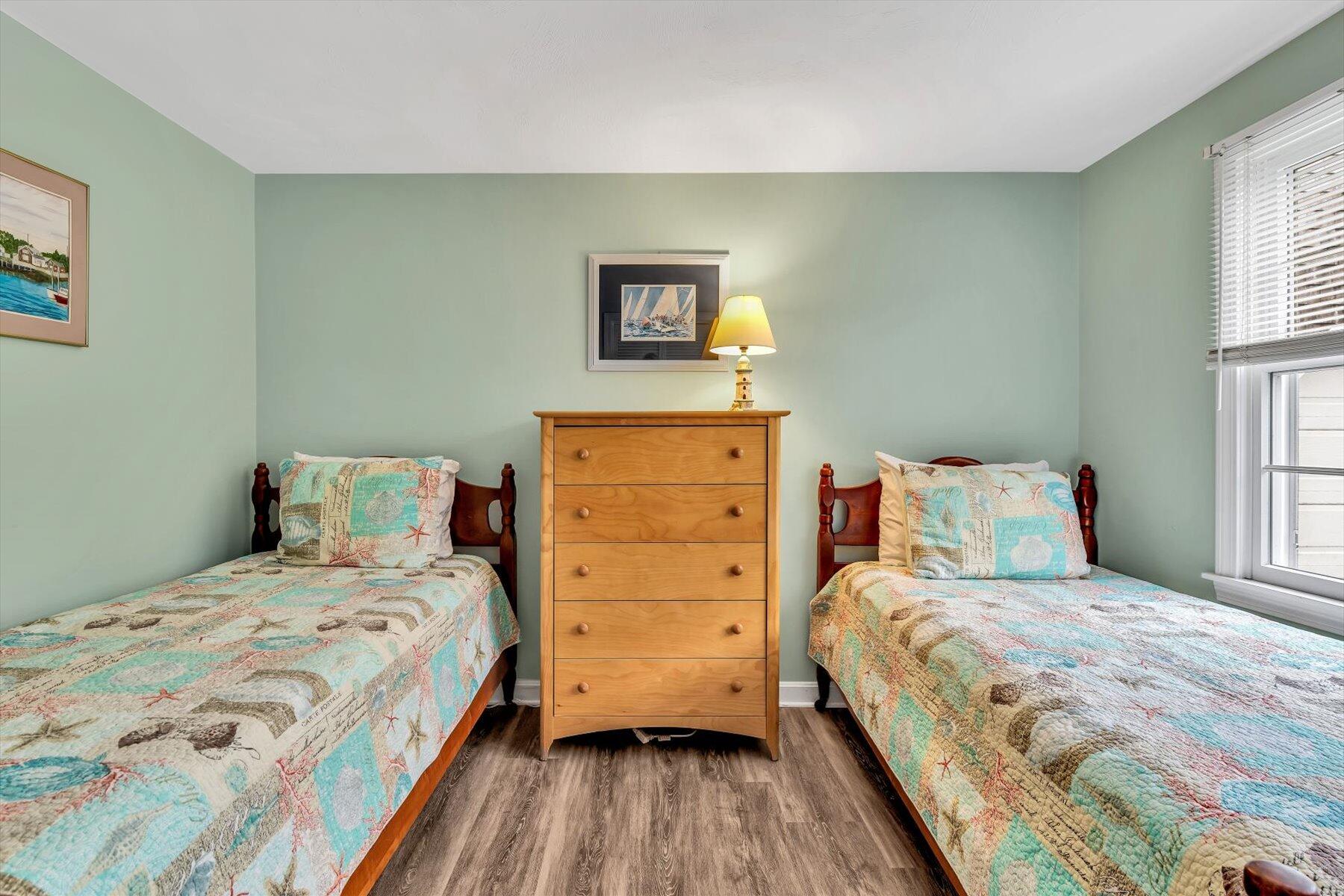 30 Cove Road Eastham, MA 02642 - Photo 41 of 72 a bedroom with a bed and a dresser