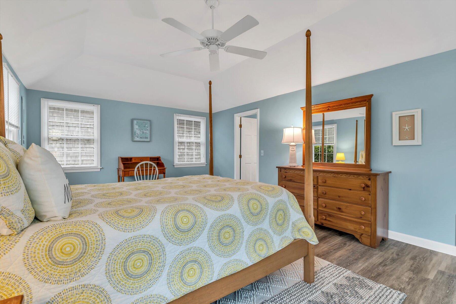30 Cove Road Eastham, MA 02642 - Photo 44 of 72 a bedroom with a bed a dresser and potted plants
