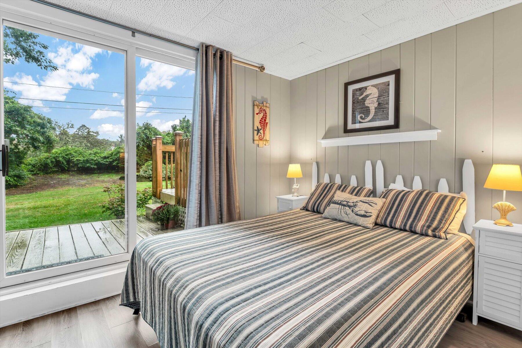 30 Cove Road Eastham, MA 02642 - Photo 53 of 72 a bedroom with a bed and a view of balcony