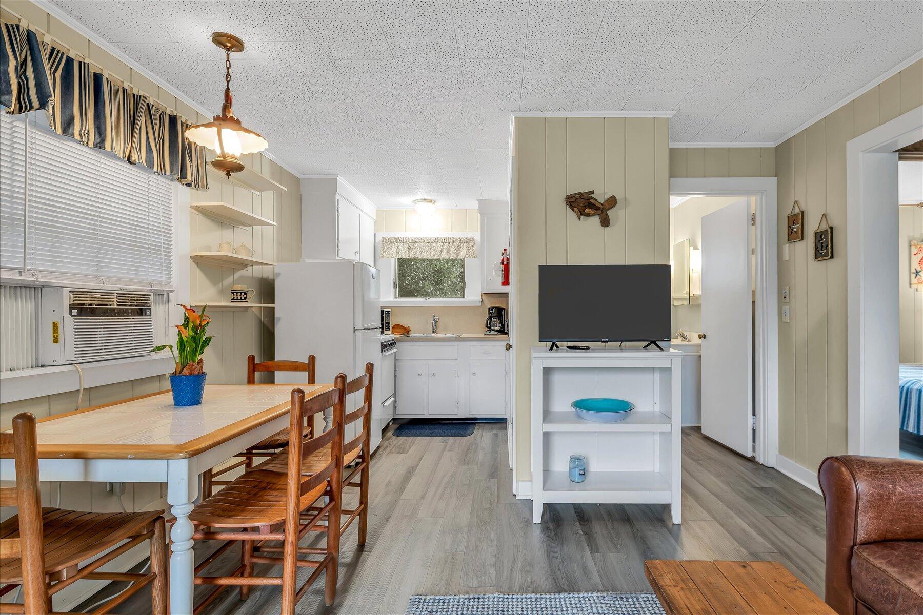 30 Cove Road Eastham, MA 02642 - Photo 60 of 72 a living room with furniture and a flat screen tv