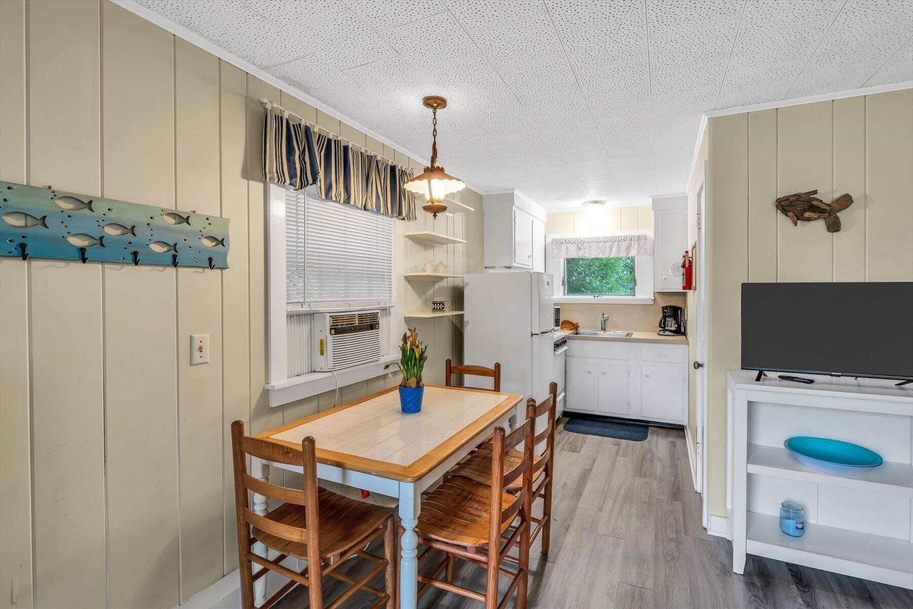 30 Cove Road Eastham, MA 02642 - Photo 61 of 72 a view of a dining room with furniture and wooden floor