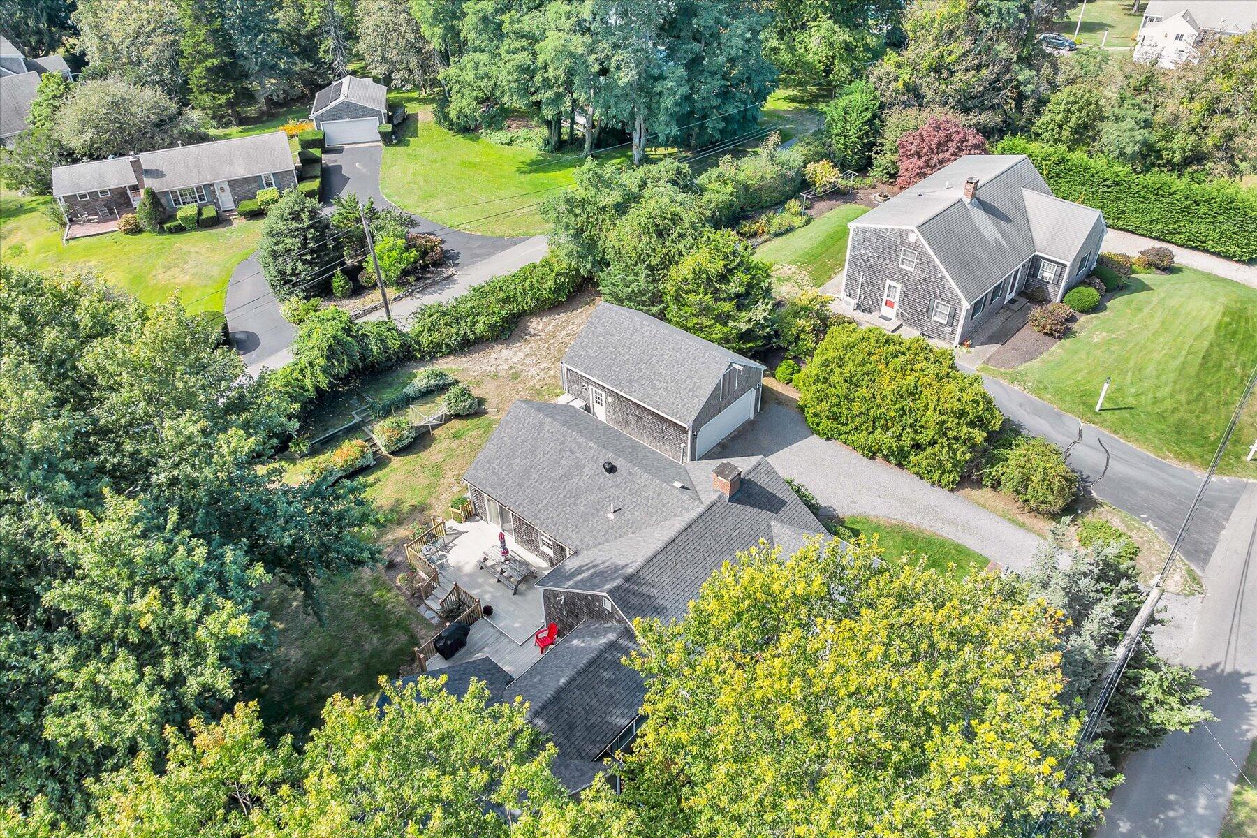 30 Cove Road Eastham, MA 02642 - Photo 8 of 72 an aerial view of a house with a garden and lake view