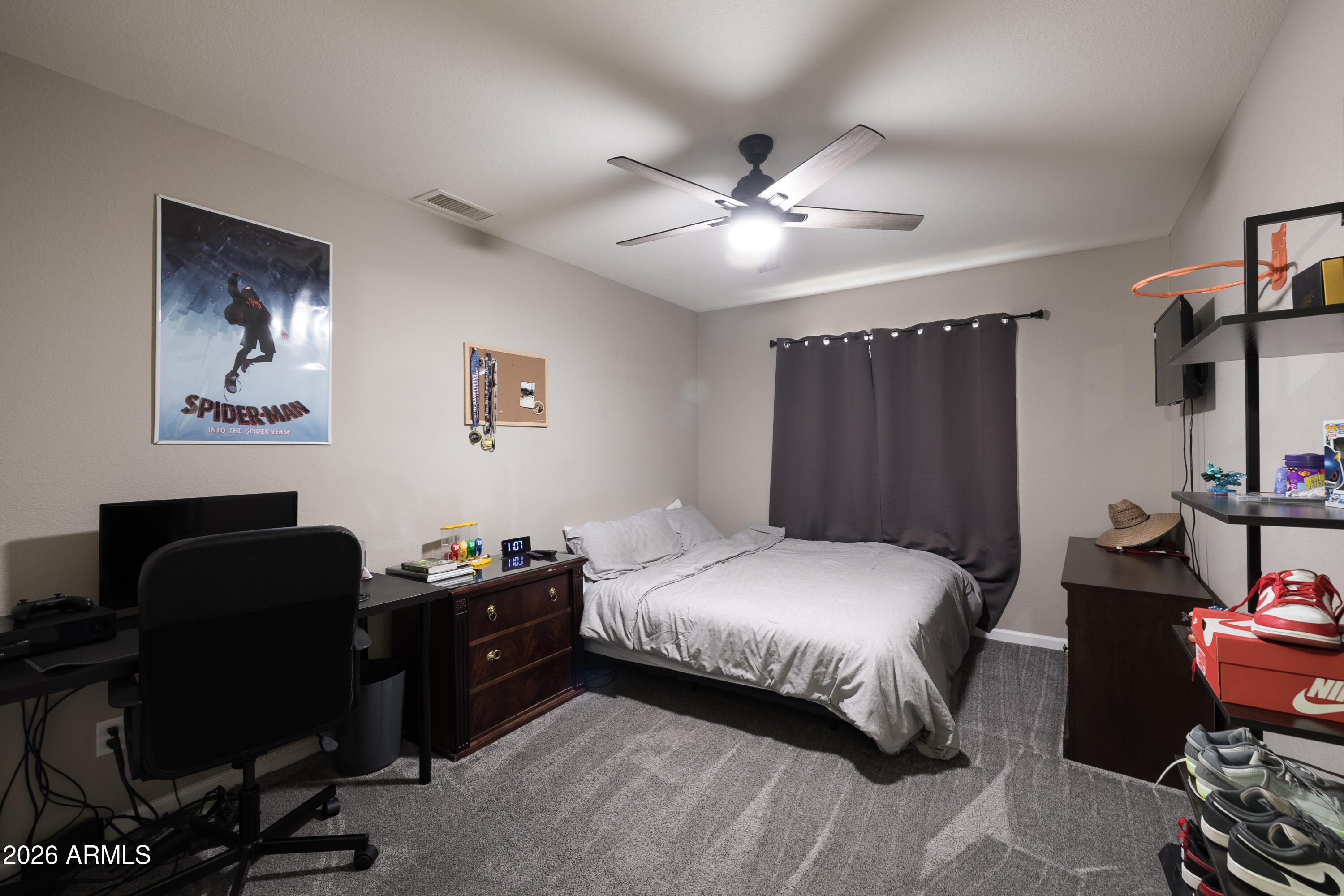 6407 West Saddlehorn Road Phoenix, AZ 85083 - Photo 33 of 41 a bedroom with a bed and a desk
