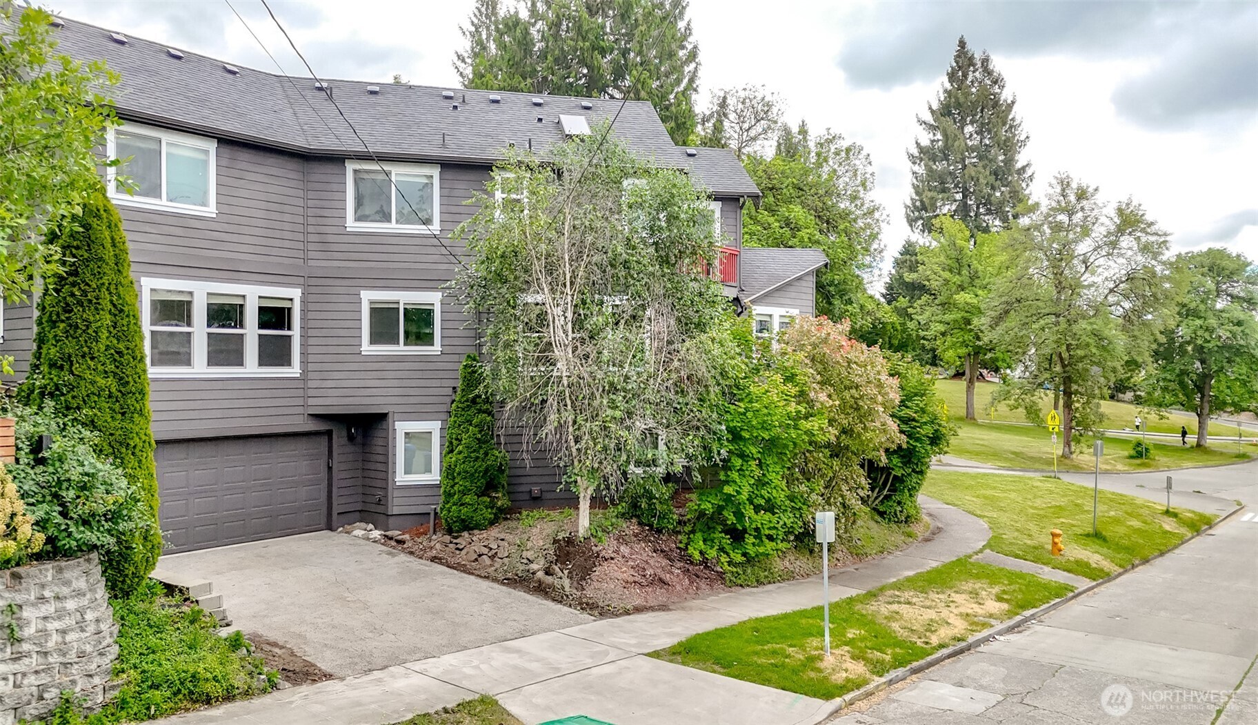 3000 South Mt Baker Boulevard Seattle, WA 98144 - Photo 39 of 40 a view of a brick house with a yard plants and large tree