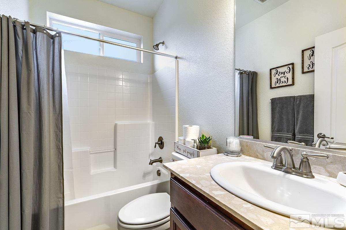 1824 Cholula Drive Reno, NV 89521 - Photo 5 of 17 a bathroom with a granite countertop sink toilet and shower