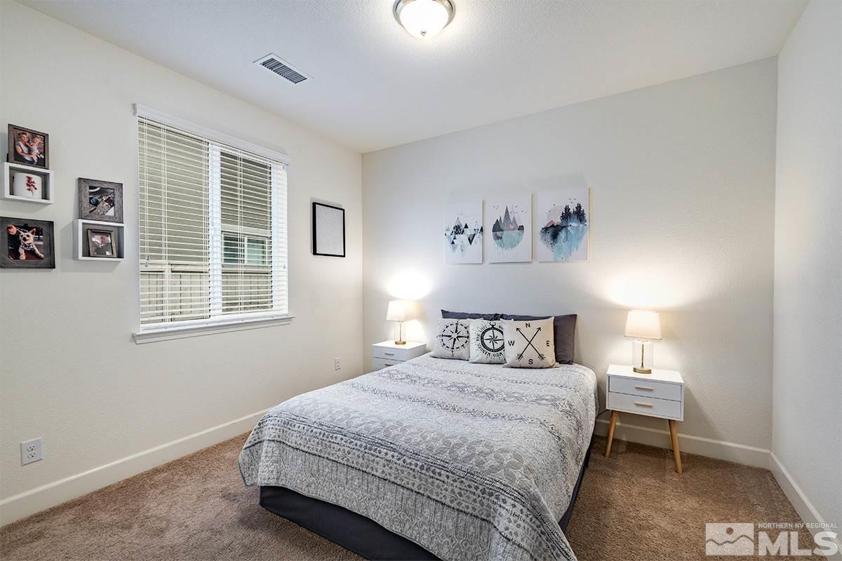 1824 Cholula Drive Reno, NV 89521 - Photo 6 of 17 a bedroom with a bed and a window