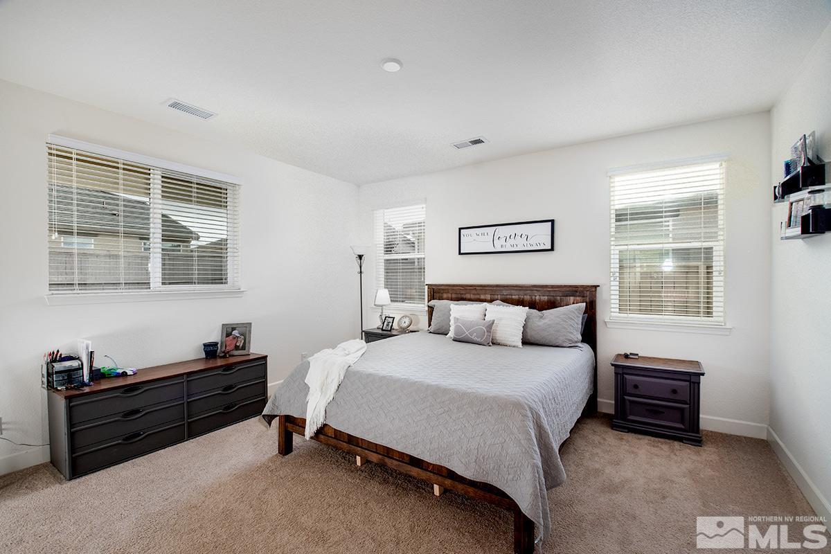 1824 Cholula Drive Reno, NV 89521 - Photo 10 of 17 a bedroom with a bed and a window