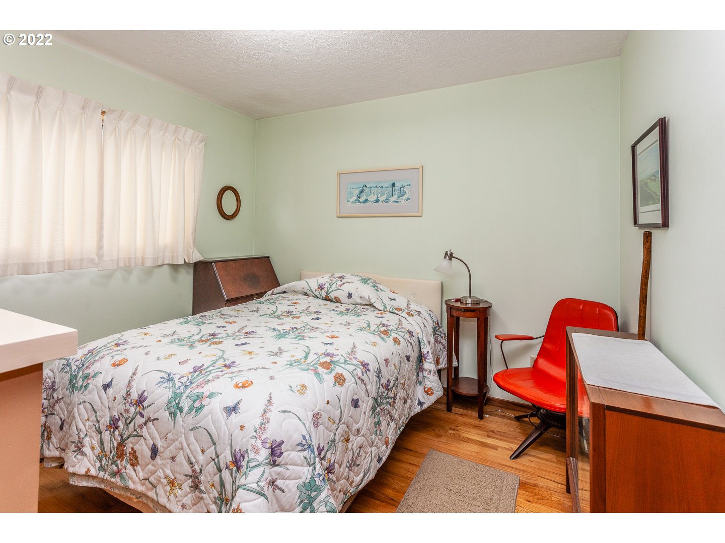 3124 Southeast 64th Avenue Portland, OR 97206 - Photo 11 of 22 a bedroom with a bed and a lamp next to window