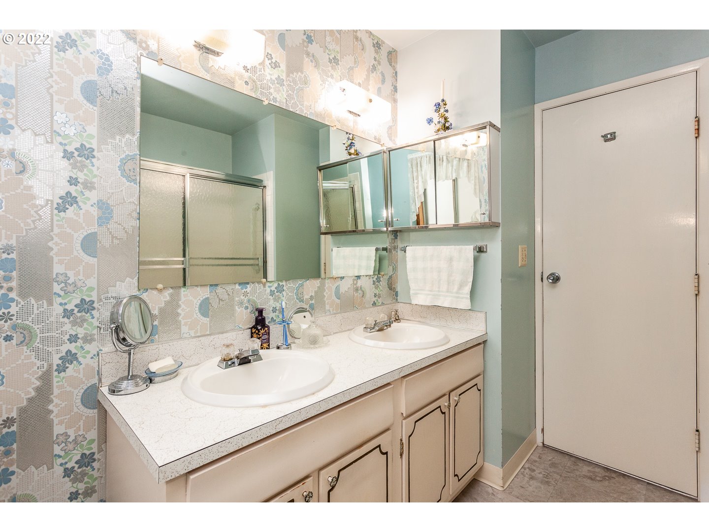 3124 Southeast 64th Avenue Portland, OR 97206 - Photo 12 of 22 a bathroom with a sink and a mirror