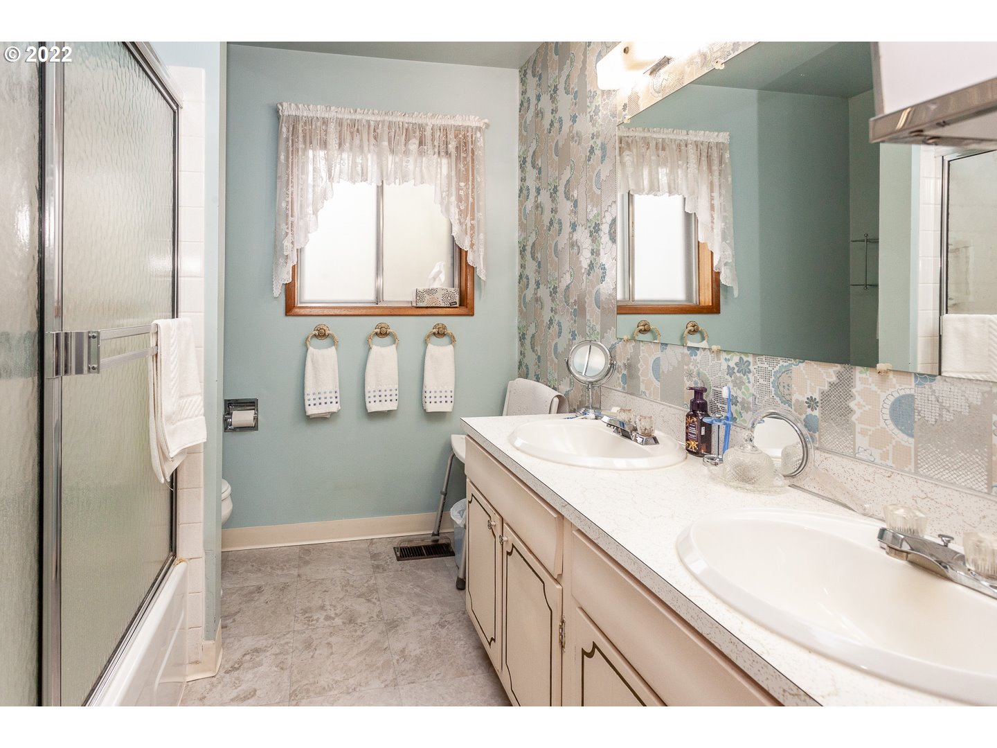 3124 Southeast 64th Avenue Portland, OR 97206 - Photo 13 of 22 a bathroom with a sink and a mirror