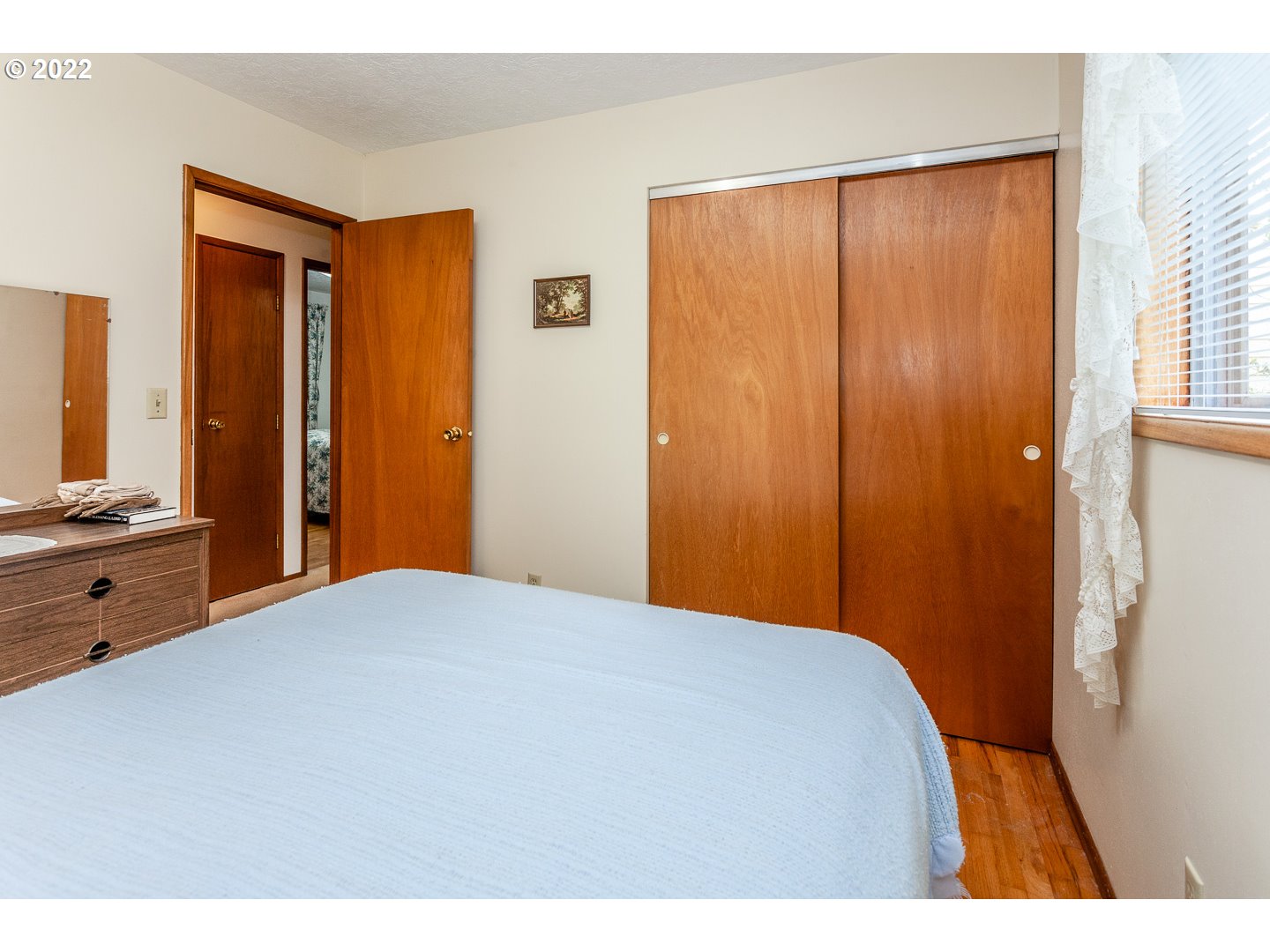 3124 Southeast 64th Avenue Portland, OR 97206 - Photo 14 of 22 a bedroom with a bed and a dresser