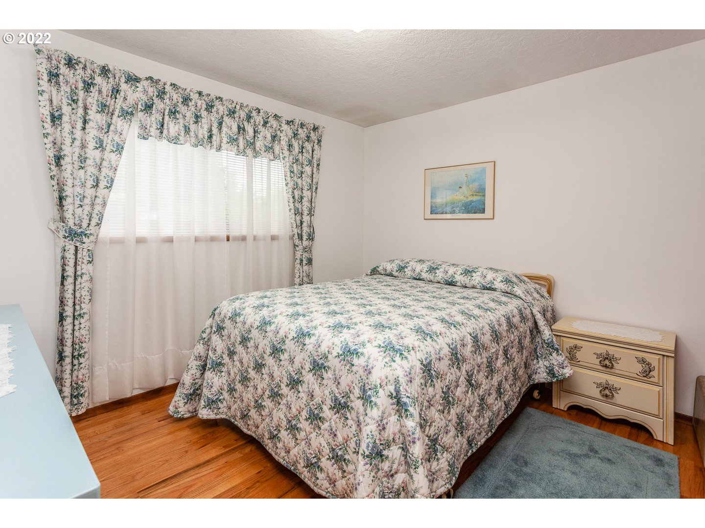3124 Southeast 64th Avenue Portland, OR 97206 - Photo 15 of 22 a bedroom with a bed and a window