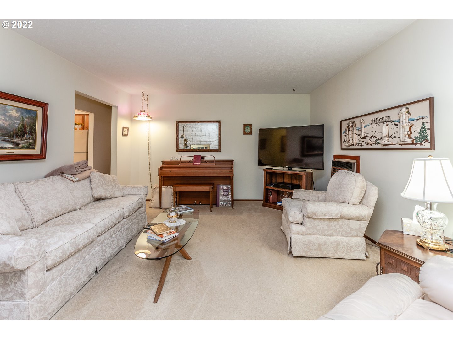 3124 Southeast 64th Avenue Portland, OR 97206 - Photo 2 of 22 a living room with furniture a flat screen tv and a wall paintings