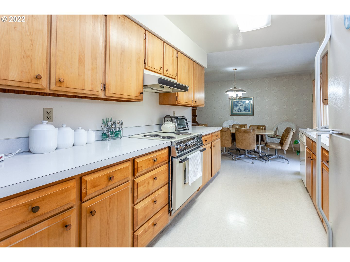 3124 Southeast 64th Avenue Portland, OR 97206 - Photo 7 of 22 a kitchen with cabinets a sink and appliances