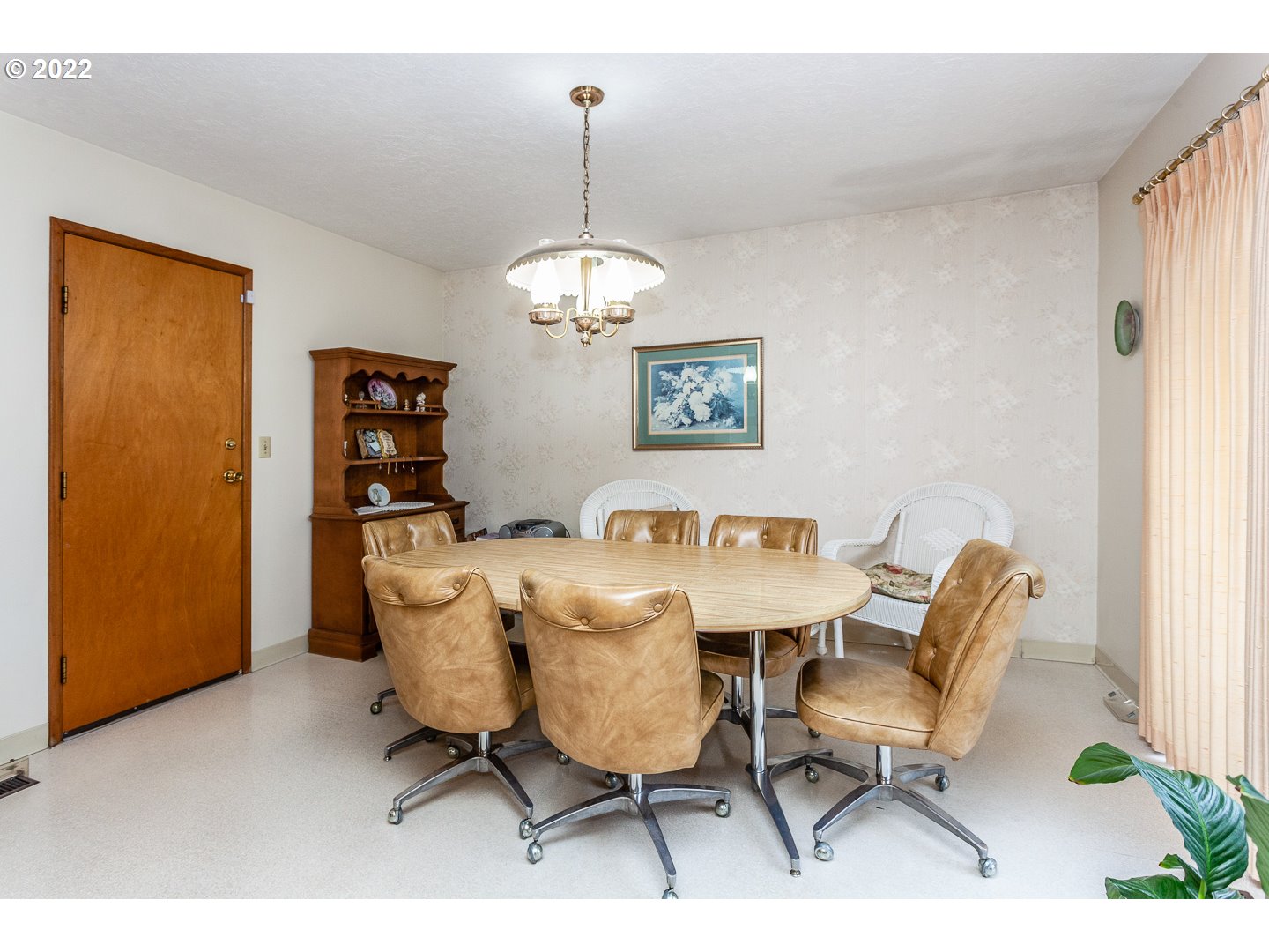 3124 Southeast 64th Avenue Portland, OR 97206 - Photo 8 of 22 a view of a dining room with furniture and chandelier