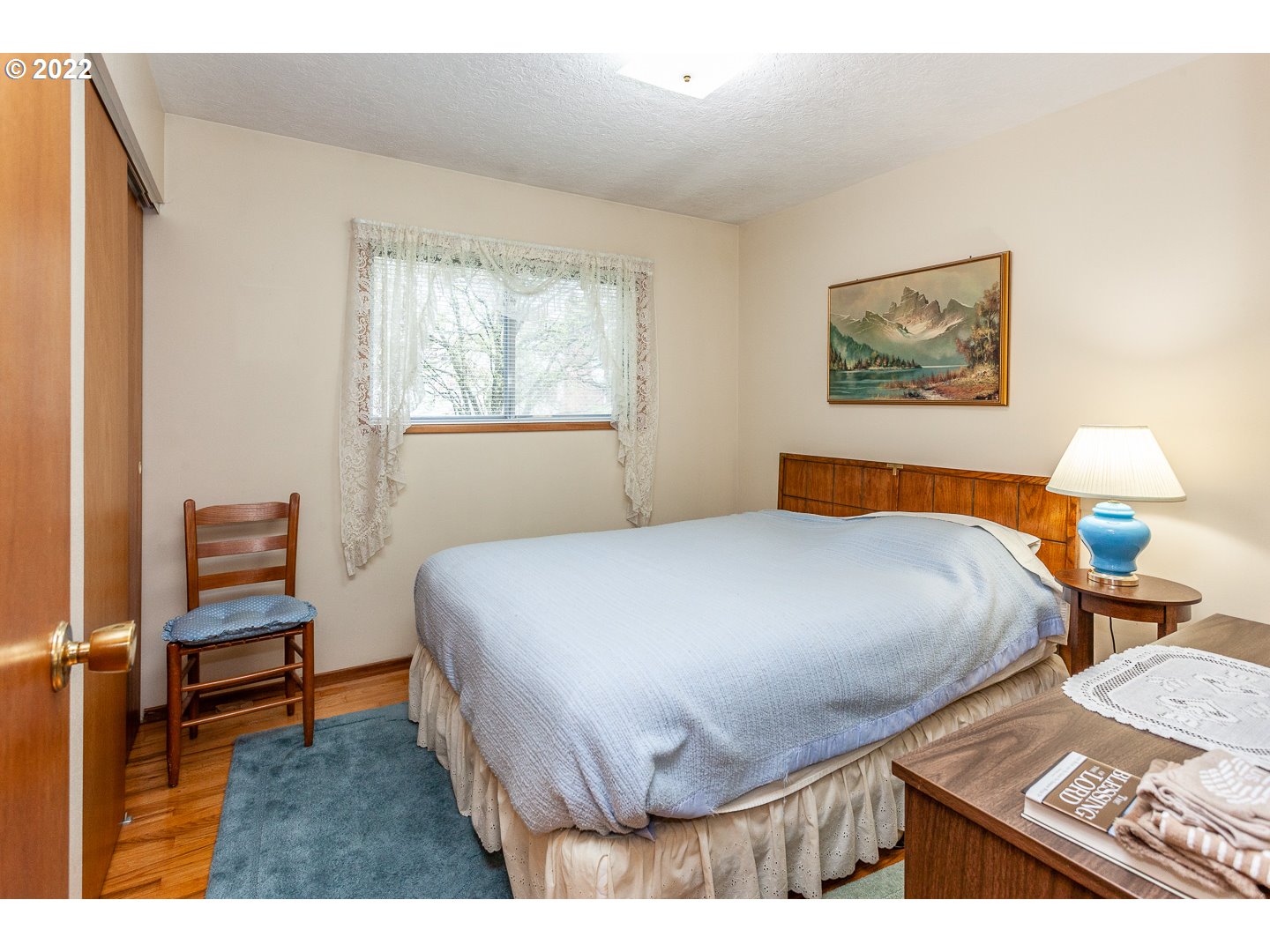3124 Southeast 64th Avenue Portland, OR 97206 - Photo 9 of 22 a bedroom with a bed and window
