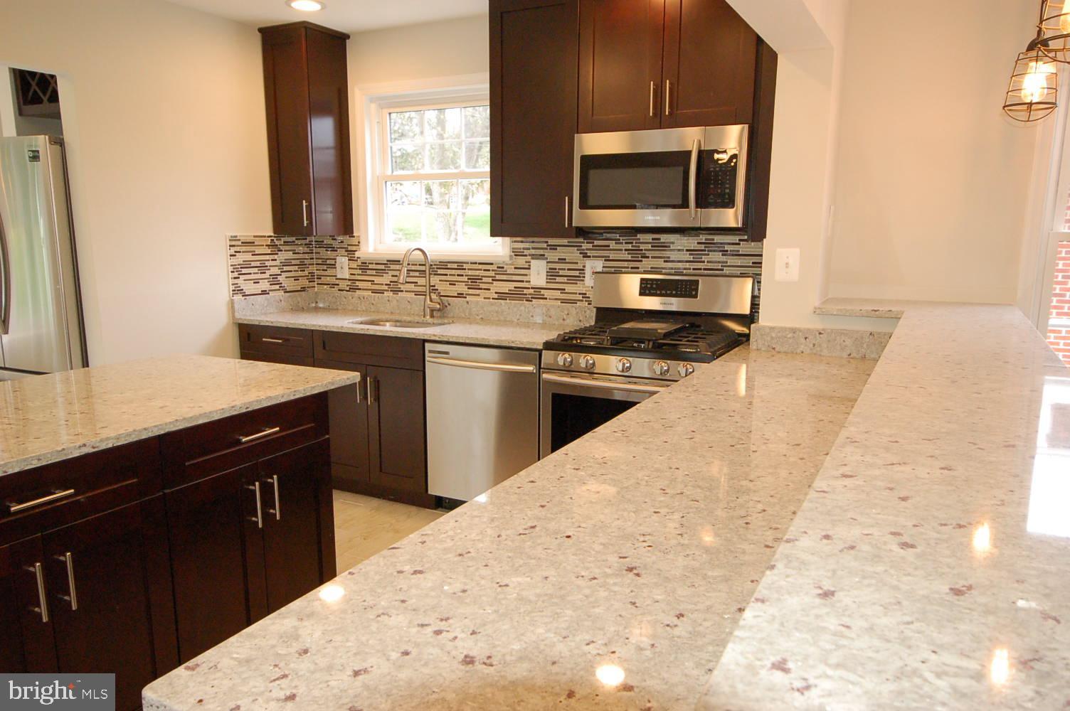 7409 Castlemoor Road Windsor Mill, MD 21244 - Photo 3 of 59 Granite island and bar
