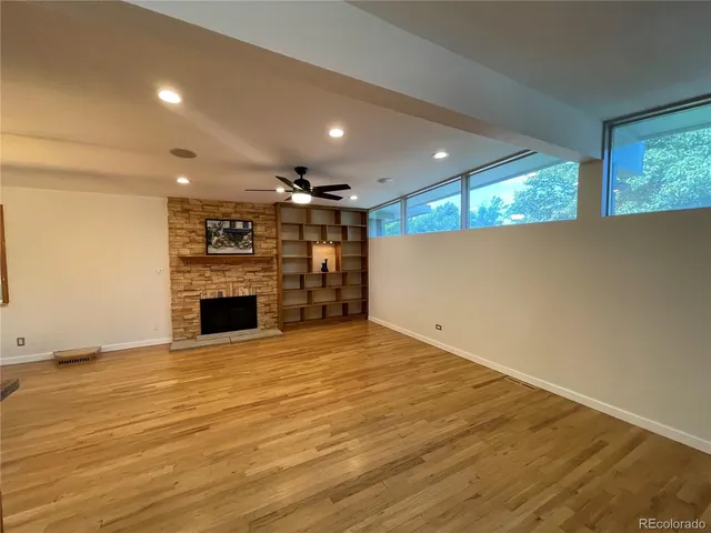 a view of a kitchen with a sink and a refrigerator