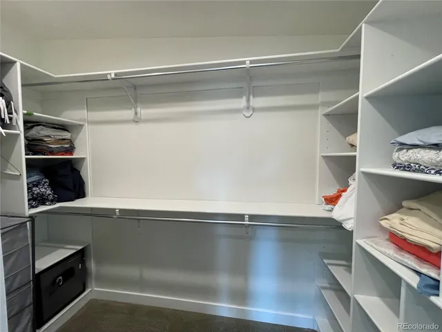 a bathroom with a sink a toilet a mirror and shower