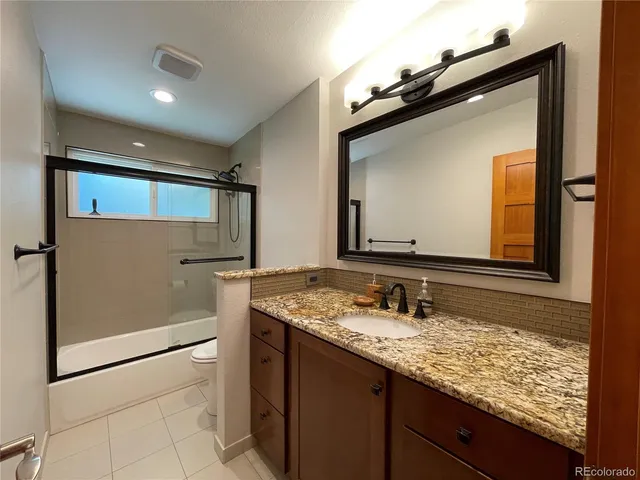 a utility room with sink dryer and washer