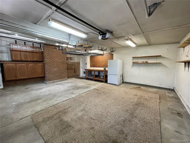 a view of a patio with couches chairs potted plants and a table