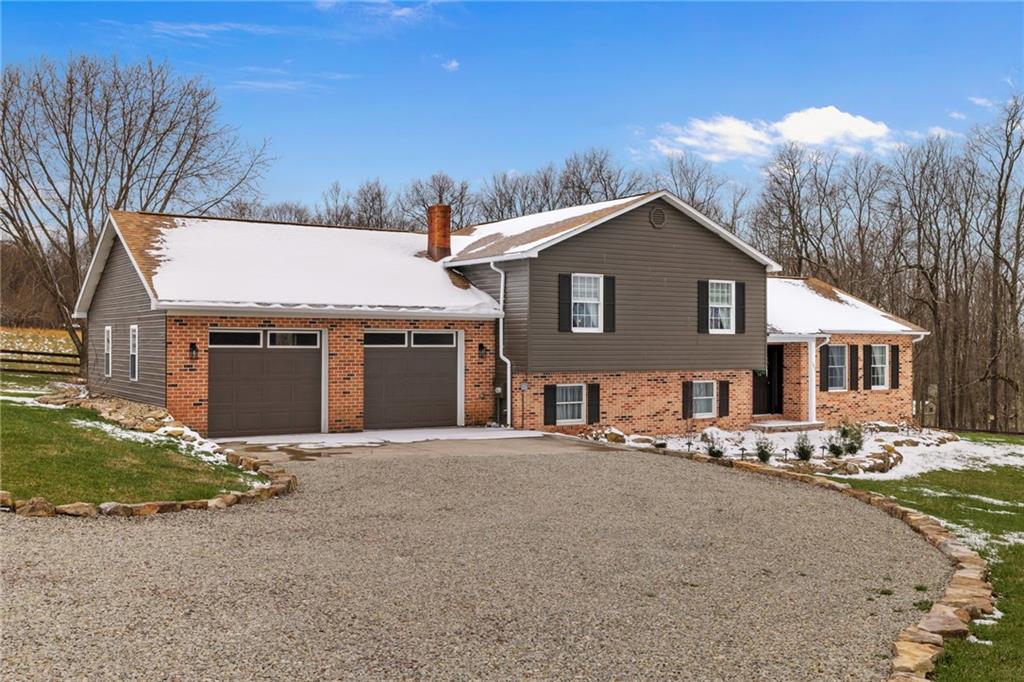 147 Fike Lane Addison, PA 15411 - Photo 3 of 50 a front view of a house with a yard